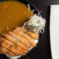 Chicken Katsu Curry · Deep-fried chicken cutlet with curry sauce and a side of rice.