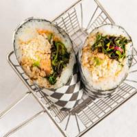 Rainbow Sushi Burrito · Hand-held Japanese sushi roll containing baked salmon, crab, meat, cucumber, avocado, and ve...
