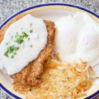 Chicken Fried Steak · Fried to a golden brown and covered with country gravy, served with two eggs any style.