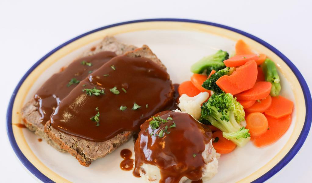 Meatloaf Dinner · Sliced homemade meatloaf, served with grilled mushrooms and onions, mashed potatoes and brown gravy.