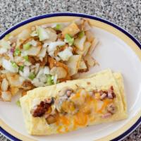 The Ultimate Omelette · Bacon, sausage, ham, mushrooms, onions and melted mixed cheeses.