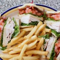 Club Sandwich · Triple decker of sliced turkey, bacon, lettuce, tomatoes and mayonnaise on toasted white bre...