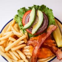Grilled Chicken Club · Grilled chicken breast, cheddar cheese, bacon, avocado slices, lettuce and tomatoes on a bun.