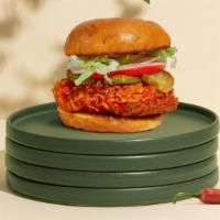 Spell Spicy Sandwich · Crispy vegan fried chicken, sliced tomatoes, shredded lettuce, jalapenos, and hot sauce. Ser...