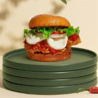 Pretty In Parm Sandwich · Crispy vegan fried chicken chicken topped with mozzarella vegan cheese and fresh house marin...