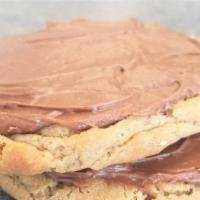 Chocolate Frosted Peanut Butter · Served warm, this soft peanut butter cookie is topped with our delicious chocolate buttercre...