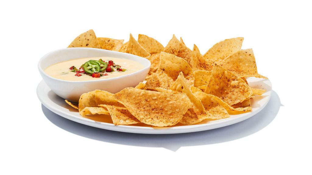 Chips & Queso · It ain’t rocket surgery. It’s a creamy blend of melted cheeses mixed with roasted red and green peppers, topped with housemade pico de gallo. Scoop it up with corn chips and go to town.