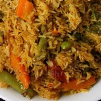 Vegetable Biryani · Long grain basmati rice flavored and cooked with mixed vegetables in a delicate blend of spi...