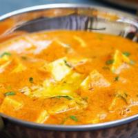 Paneer Butter Masala · Paneer cooked in a rich cream sauce with exotic herbs and spices. Served with steamed rice