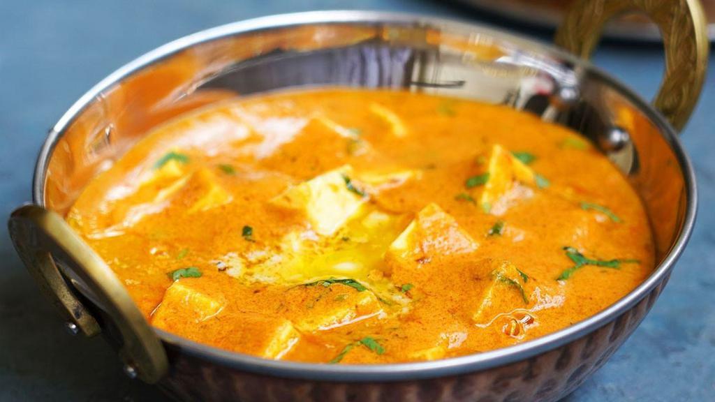 Paneer Butter Masala · Paneer cooked in a rich cream sauce with exotic herbs and spices. Served with steamed rice
