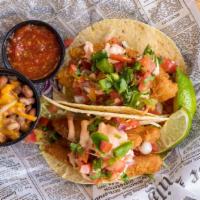 Pub Fried Tacos · Lightly battered cod, flash fried and tucked into a fresh flour tortilla with cabbage and pi...
