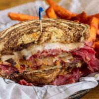 Reuben'S High On Rye · Lean corned beef, simmered in our Barrio Rojo ale and traditional spices, caramelized with o...