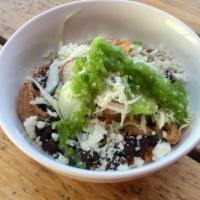 Green Bowl · Rice, frijoles negros, pulled rotisserie chicken, slaw, cotija cheese, salsa Verde, salsa ha...