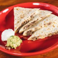Quesadilla Grande · Flour tortilla filled with your choice of meats, mozzarella cheese with guacamole and sour c...