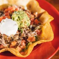 Traditional Taco Salad · Served with your choice of meat with beans, shredded lettuce, tomatoes, cheese, sour cream a...