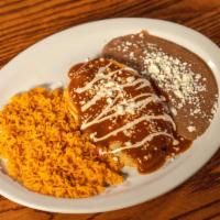 Chile Relleno · Cheese stuffed poblano pepper. Topped with our traditional red sauce, garnished with queso f...