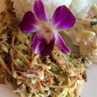Kalua Pork & Cabbage · Pork shoulder with Hawaiian sea salt and pineapple, wrapped in banana leaves and slow cooked...