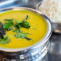 Tarka Dal (Vegan) · Mixed of four types of yellow lentils and beans sautéed with garlic, onions, ginger, and tom...