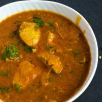 Chicken Curry · Traditional curry made with a base of onions, garlic, ginger with added herbs, spices.