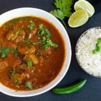 Goat Curry · Slow cooked traditional bone-in meat with onions, tomatoes, ginger, garlic and aromatic spic...