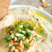 Hummus · Serves with pita
Pureed Garbanzo Beans, fresh lemon, tahini, Garlic