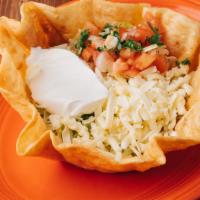 Taco Salad
 · Our traditional taco salad is served on a crisp flour tortilla shell
with cheese melted over...