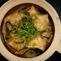 Lobster Wontons · With shiitake ginger broth.