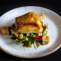 Miso Glazed Chilean Sea Bass · With wok vegetables.