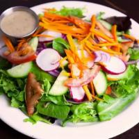 House Salad · Spring mix, tomato, red onion, cucumber, carrots and radish with dressing on the side.