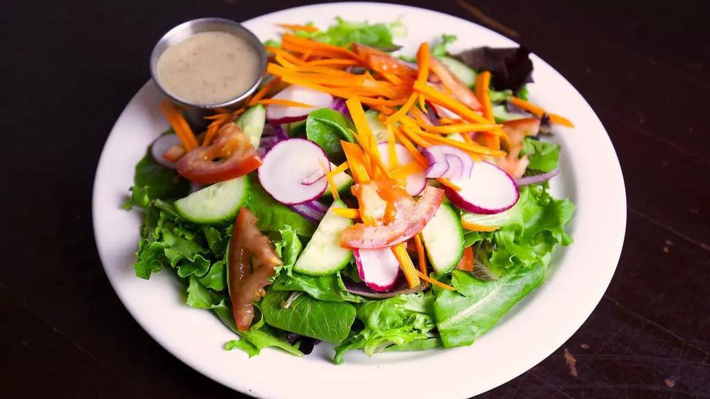 House Salad · Spring mix, tomato, red onion, cucumber, carrots and radish with dressing on the side.