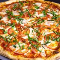 1 - Margherita Pizza · Garlic, fresh mozzarella and basil.