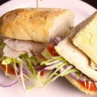 Turkey Sandwich · Roasted turkey, shredded lettuce, tomato, red onion, herbed mayo and provolone. Served on a ...
