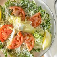 Caesar Salad · Romaine lettuce tossed with our own caesar dressing, seasoned croutons, and topped with shre...