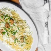 Angel Hair Pasta · Sautéed with garlic, olive oil, and topped with Parmesan and feta.