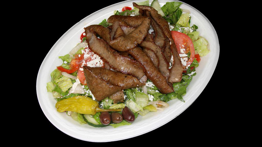 Gyro Greek Salad · Classic greek salad served with gyros meat, includes pita bread and sauce.