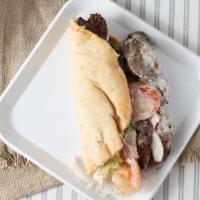 Steak Kabob Sandwich · A kabob of tender pieces of tri-tip sirloin marinated and flame broiled with hummus and garl...