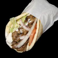 Steak Shawarma · Thin sliced steak marinated with our special seasonings and slow cooked on a vertical skewer...