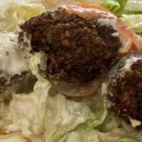 Falafel Sandwich · A vegetarian favorite, a delicious blend of ground garbanzo beans, vegetables, and spices de...
