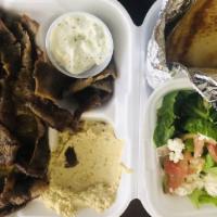 Gyro Plate · Seared layers of select beef and lamb perfectly seasoned with zesty spices, broiled on a ver...