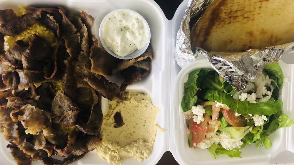 Gyro Plate · Seared layers of select beef and lamb perfectly seasoned with zesty spices, broiled on a vertical skewer, and thinly sliced. Served with our own tzatziki sauce.