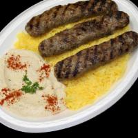 Ground Beef Kabob Plate · Three kabobs of lean, seasoned ground beef served with our own garlic sauce.