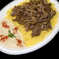 Steak Shawarma Supreme · Marinated beef, broiled on a vertical skewer, thinly sliced, and served with our own garlic ...