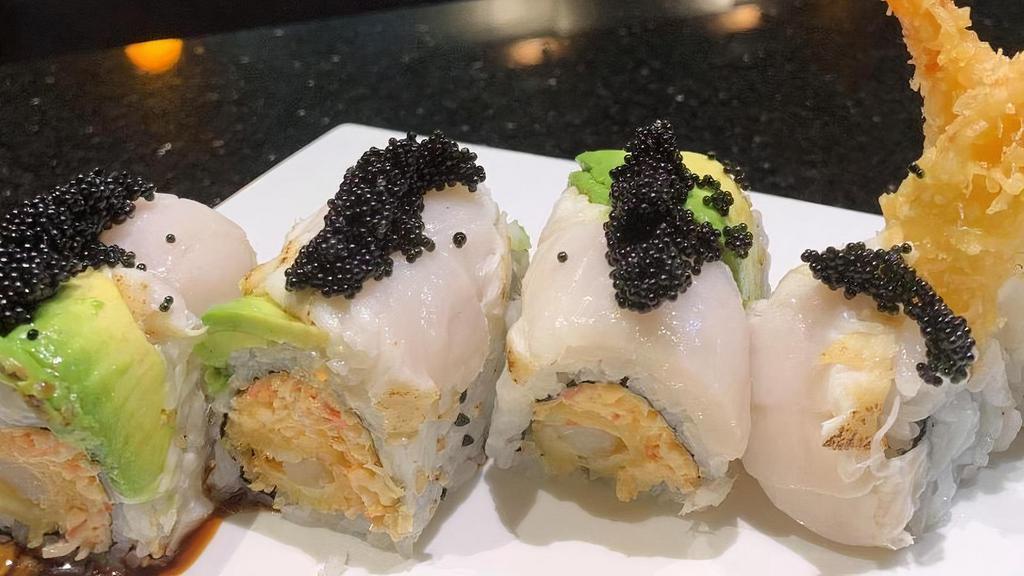 Snow White Roll · Shrimp tempura, snow crab topped with white tuna. avocado, black tobiko w. spicy mayo, eel sauce
