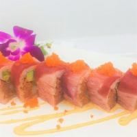 Pink Lady Roll · Shrimp Tempura, spicy tuna, avocado wrapped by soy . paper, topped with yellowtail, tuna, ee...