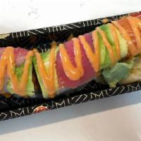 Outstanding Roll · In: spicy tuna, kani, and cucumber. Top: tuna, salmon, yellowtail, avocado with spicy mayo.