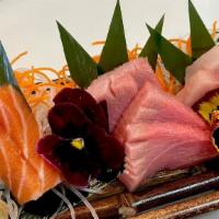 Sashimi Trio · Tuna, Salmon, Yellowtail 5 pcs sashimi with sushi rice; choice of miso soup OR house salad.