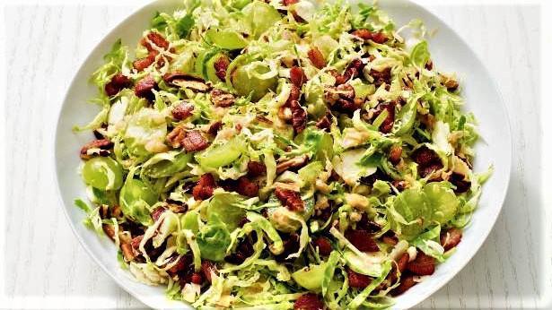 Brussel Sprout Slaw · Pecorino Romano, parsley, grapes, toasted almonds tossed in a sherry vinaigrette. Come in a choice of seasoning.