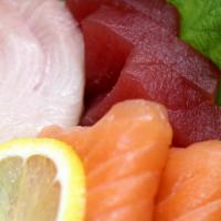 Small Sashimi Plate (8) · Tuna, salmon, yellow tail.
