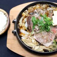 Beef Sukiyaki · House broth, thin sliced beef, onion, tofu, Napa cabbage, yam noodle.