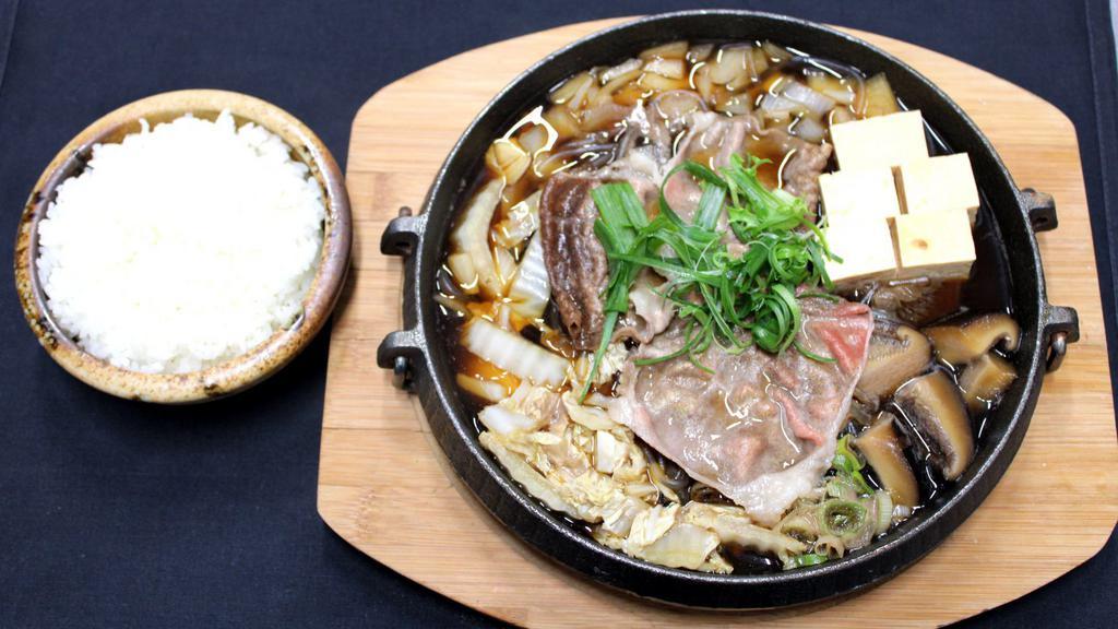 Beef Sukiyaki · House broth, thin sliced beef, onion, tofu, Napa cabbage, yam noodle.